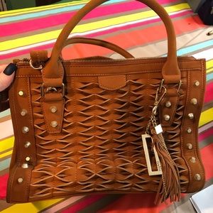 Large bag with handles and shoulder strap.